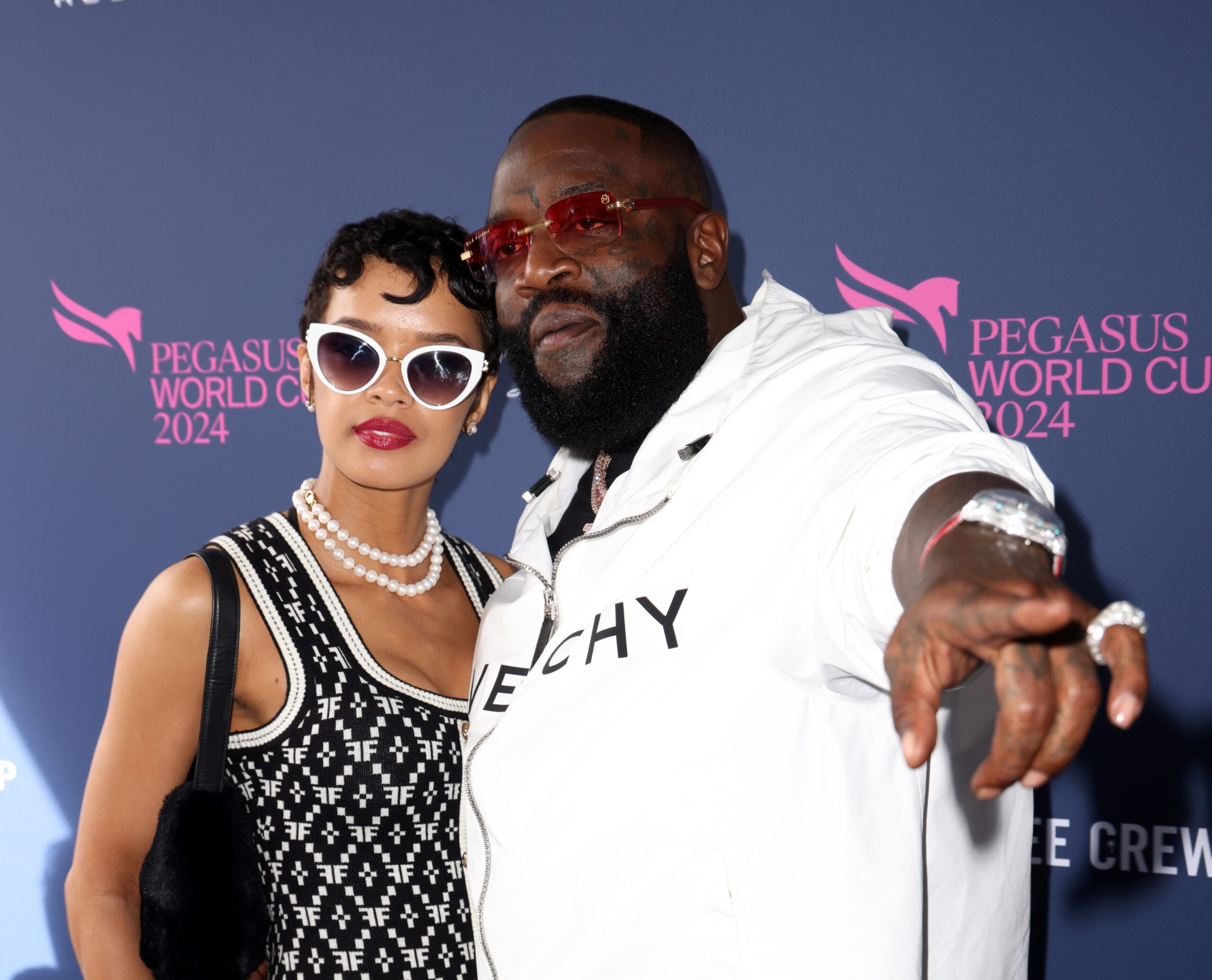 HALLANDALE, FLORIDA - JANUARY 27: Cristina Mackey and Rick Ross attend the 2024 Pegasus World Cup Presented By Baccarat at Gulfstream Park on January 27, 2024 in Hallandale, Florida. (Photo by Alexander Tamargo/Getty Images for 1/ST)