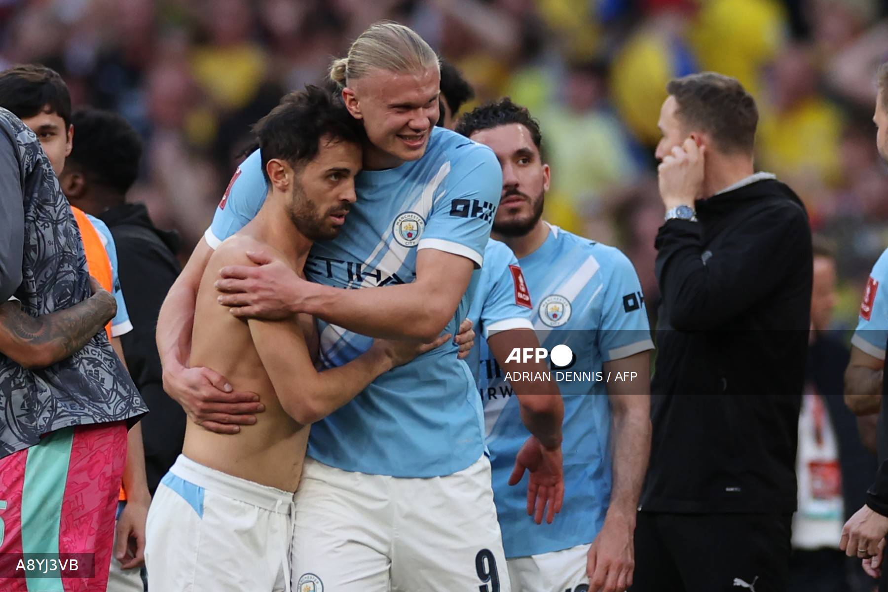 Manchester City's Portuguese midfielder #20 Bernardo Silva (L) and Manchester City's Norwegian striker #09 Erling Haaland embrace on the pitch after the English FA Cup semi final football match between Manchester City and Southampton at Wembley stadium in London, on April 25, 2026. City won the game 2-1 (Photo by Adrian Dennis / AFP) / NOT FOR MARKETING OR ADVERTISING USE / RESTRICTED TO EDITORIAL USE